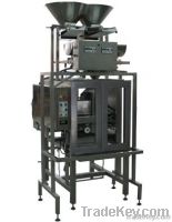 Vertical packaging machine AM009 with a double head linear weigher