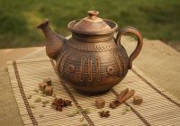 Handmade ceramic tea pot made of red clay.