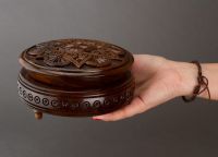 Handmade round wooden jewelry box with carving