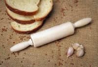 Wooden rolling pin for dough.