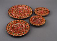 Painted wooden plate set of four plates.