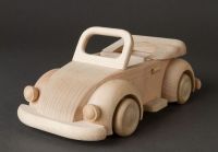 Children&apos;s wooden toy car in retro style for play and creativity.