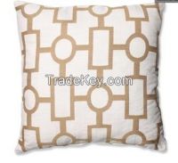 beige and white geometric-printed throw pillow