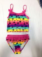 Girls tankini two-piece swimsuit / tank top and panty in colorful striped pattern.