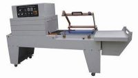 CONTINUOUS SEAL-CUT-SHRINK PACKAGING MACHINE