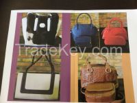 Handbags, briefcases, wallets, belts, business portfolios