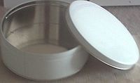 blank, white cookie tins