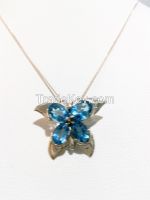 Silver pendant set with blue topaz 