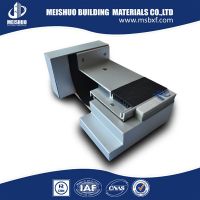 Extruded aluminum expansion joint cover with rubber insert in building materials